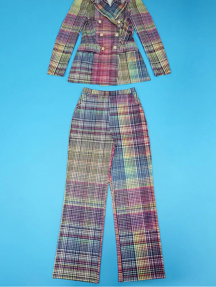A two-piece women's suit set consisting of a double-breasted blazer and matching trousers in a multicolor plaid pattern, displayed flat against a solid blue background with the brand name 'Znaiml' in the top left corner.